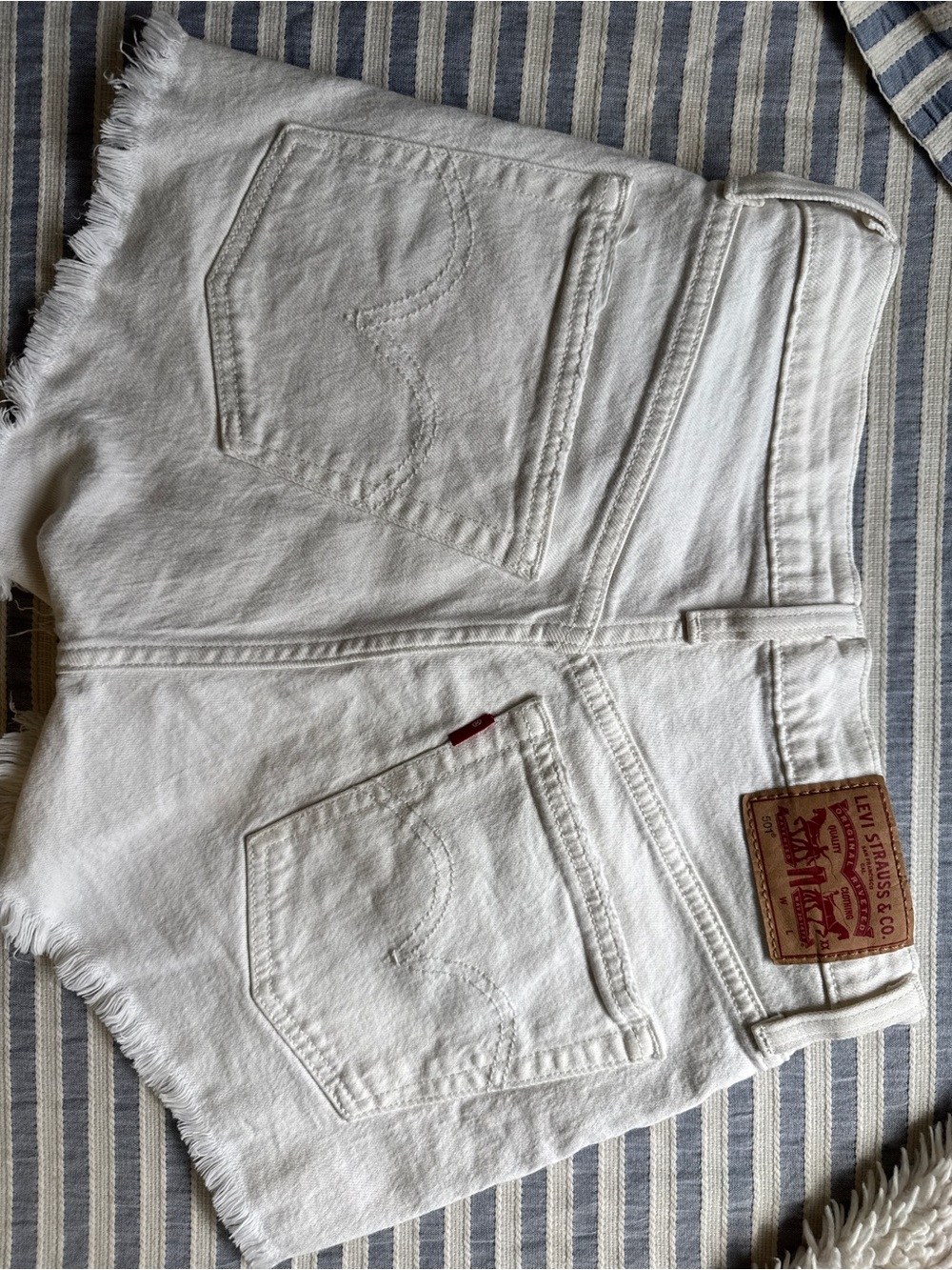 Levi's White Denim Cutoff Shorts with Frayed Hem